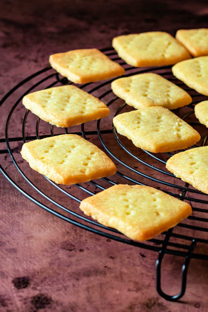 A wire rack with rectangular shortbread cooling.