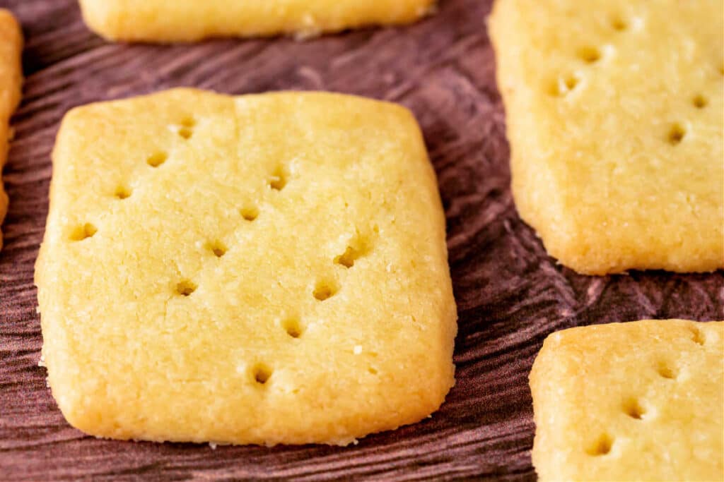 A close up of a cut-out shortbread cookie.