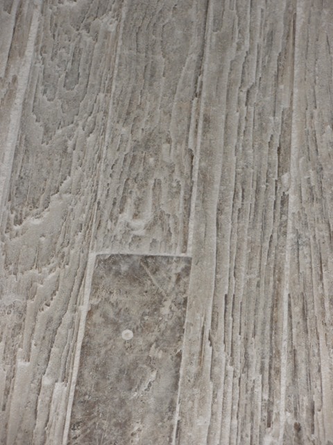 close up of the wooden flooring covered in fine corn dust