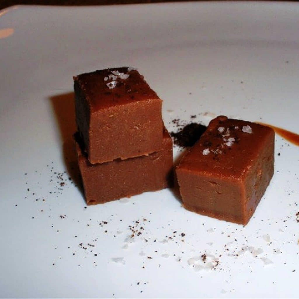 Pieces of spiced fudge on a plate.