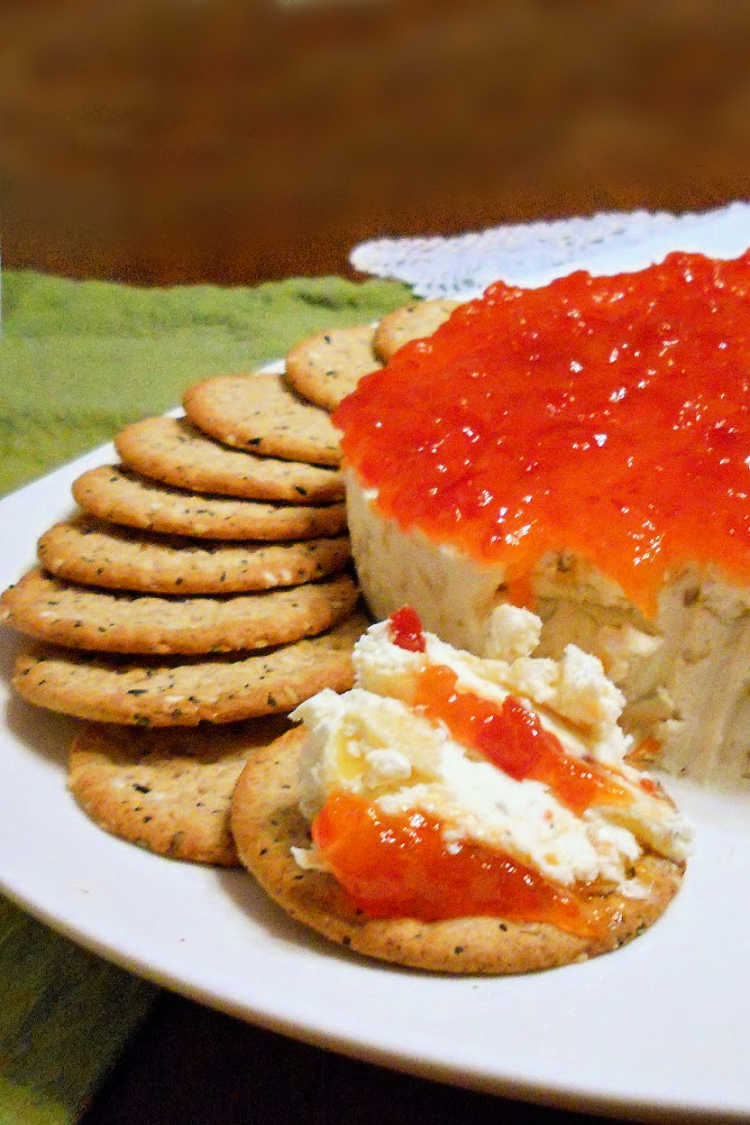 The goat cheese cheesecake with pickled peppers and pepper jelly along with crackers.