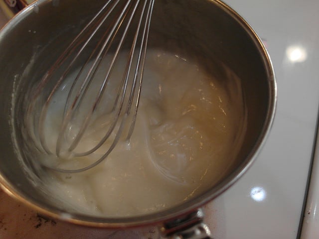 Tangzhong mixture of flour and water in pan with whisk.