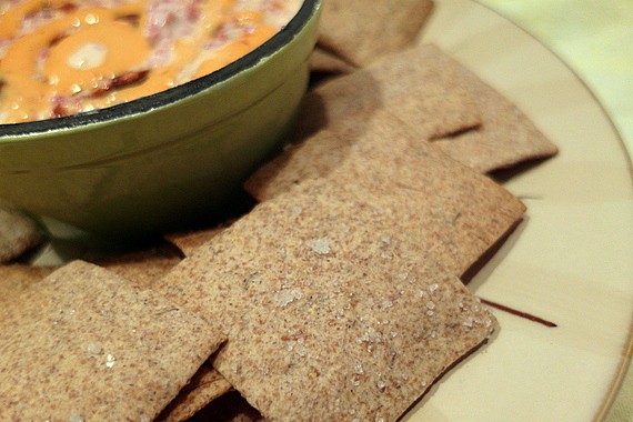 Caraway rye crackers with Reuben dip on a plate ready for serving.