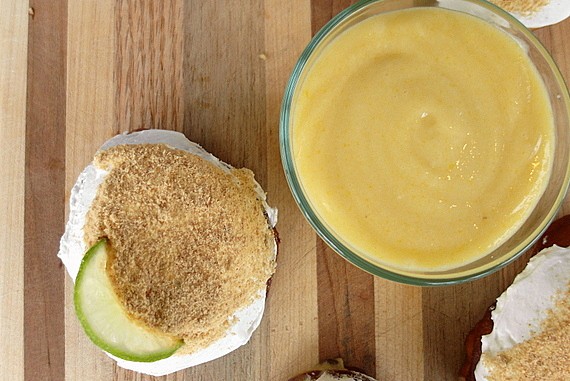 An overhead view of key lime pie doughnut and key lime curd.