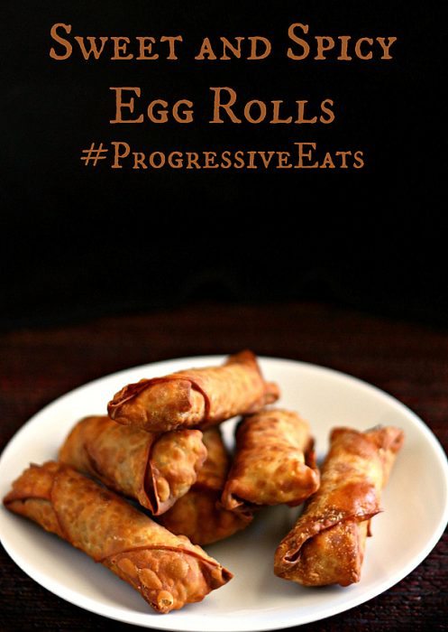 Golden crispy sweet and spicy pork egg rolls on a white plate.