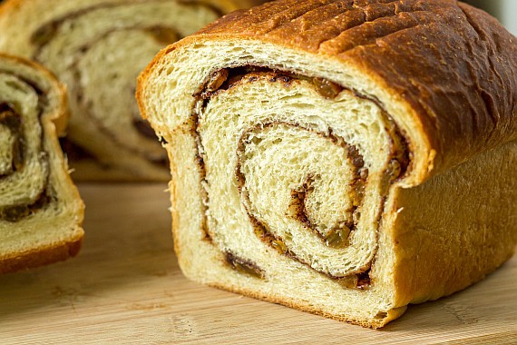 a sliced loaf of cinnamon raisin swirl bread