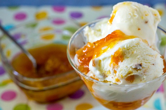 a dish of ice cream and a container of peach jam