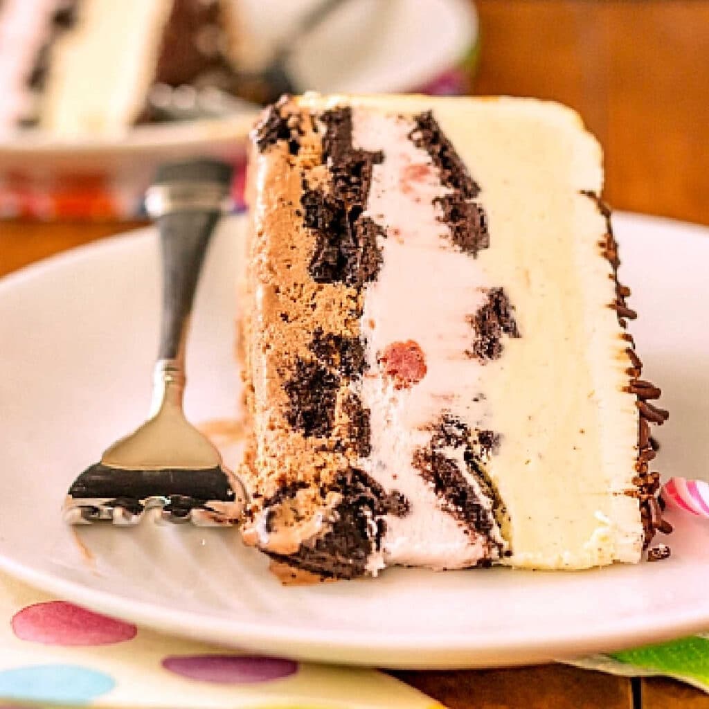 A close up of a slice of birthday ice cream cake.
