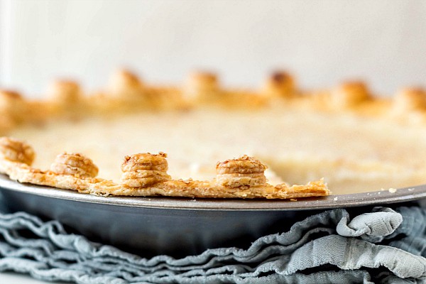 Close up of pie with a button crust treatment.