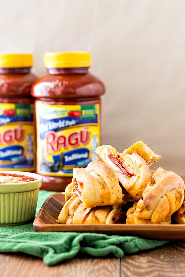 A platter of Homemade pizza bread with jars of Ragu in the background.  