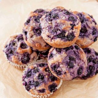 An overhead shot of a stack of dairy free blueberry muffins.