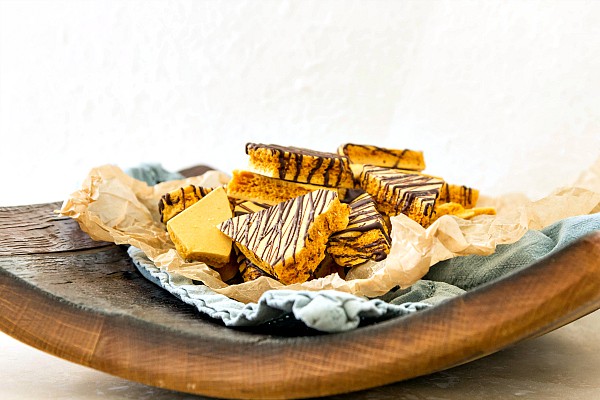 A plate of honeycomb candy drizzled with chocolate.