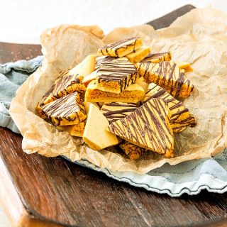 a plate of chocolate drizzled honeycomb candy