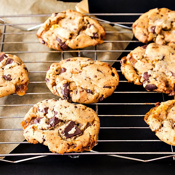 Chocolate chip bourbon honeycomb cookies on a cooling rack.