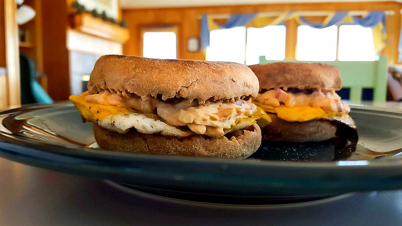 Spicy smoky pimento cheese on egg sandwiches made on English muffins.