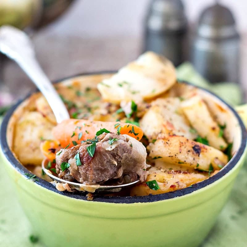 An individual serving of Ballymaloe Irish Stew with a spoonful ready for a bite.