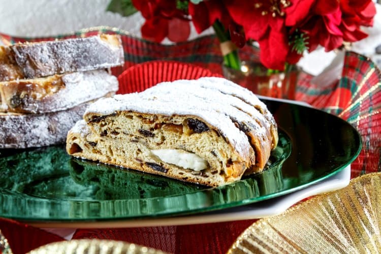 Christmas stollen made with Idaho Potatoes cut open and showing the mixture of fruits and spices on the interior.