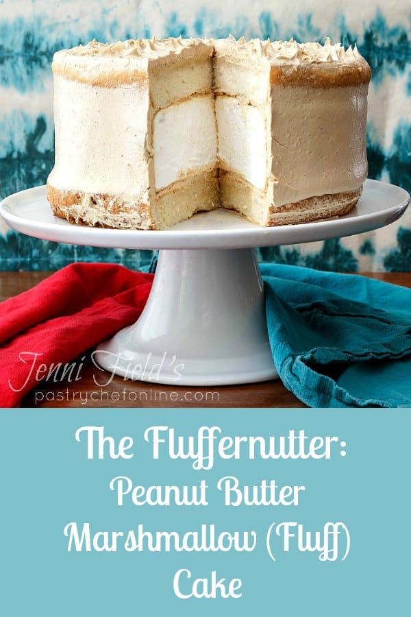 Peanut butter marshmallow cake cut and on a white platter. text reads "The Fluffernutter: peanut butter marshmallow (Fluff) Cake".