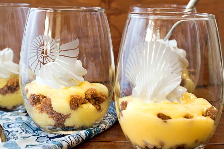 Four key lime pie parfaits in glasses.