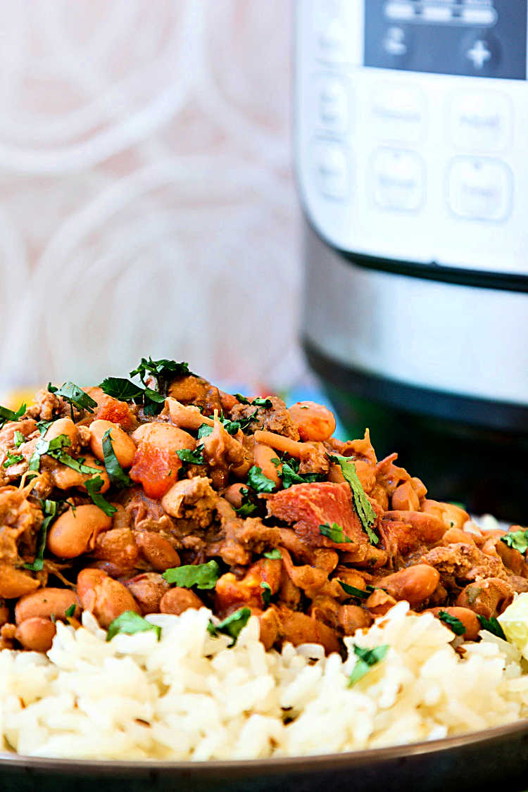 Instant pot charro beans over rice with an instant pot in the background.