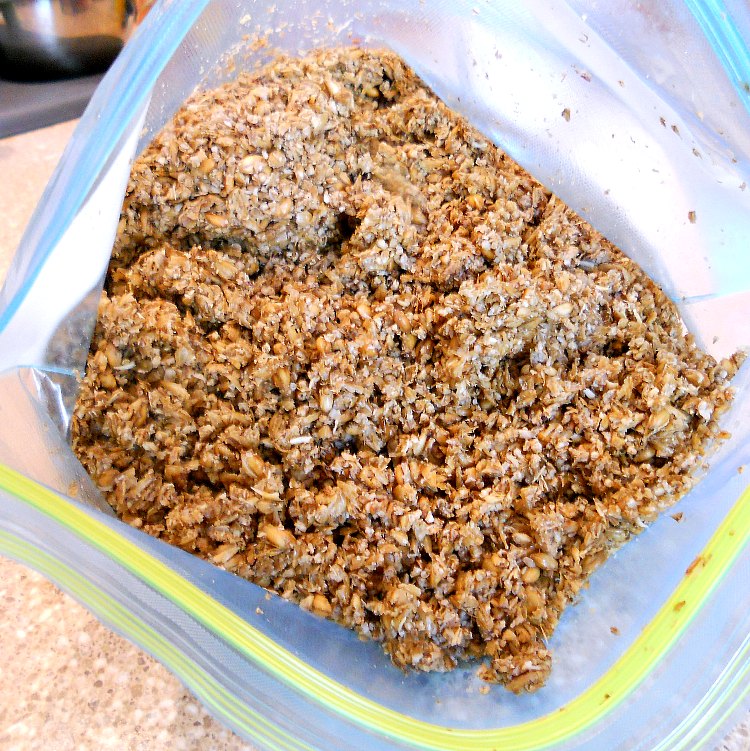 A gallon zip top bag full of spent grains from brewing beer.