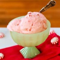 a green bowl of homemade peppermint ice cream