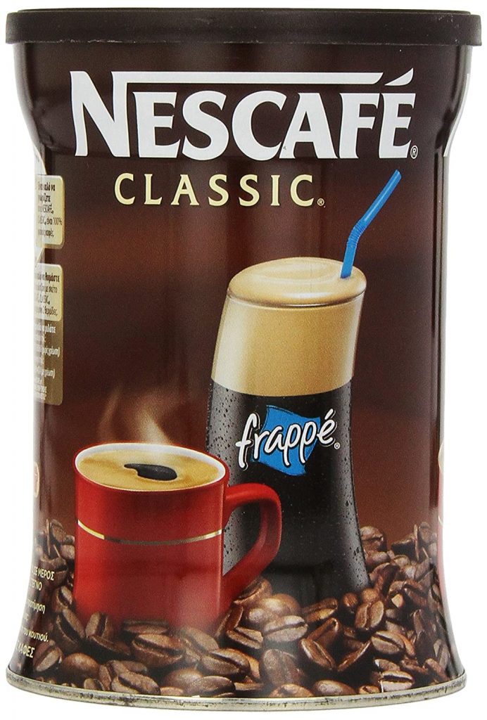 A brown metal canister of Nescafe Classic instant coffee from Greece.