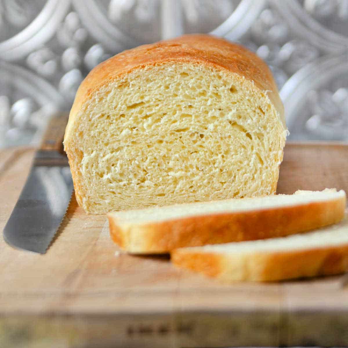 A close up of a sliced loaf of bread showing crumb. 
