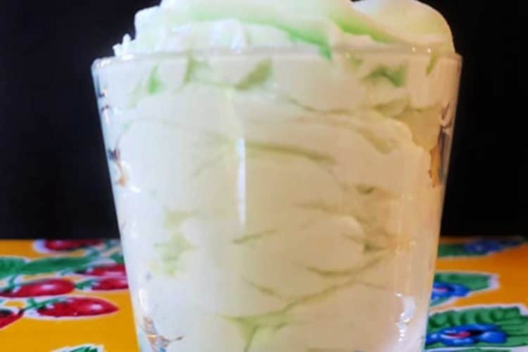 glass filled with swirls of mint buttercream