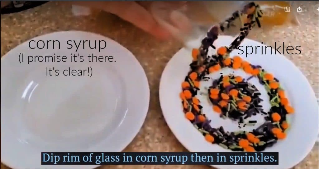 Two plates, one with corn syrup on it and one with Halloween sprinkles. Text reads: "dip rim of glass in corn syrup then in sprinkles".
