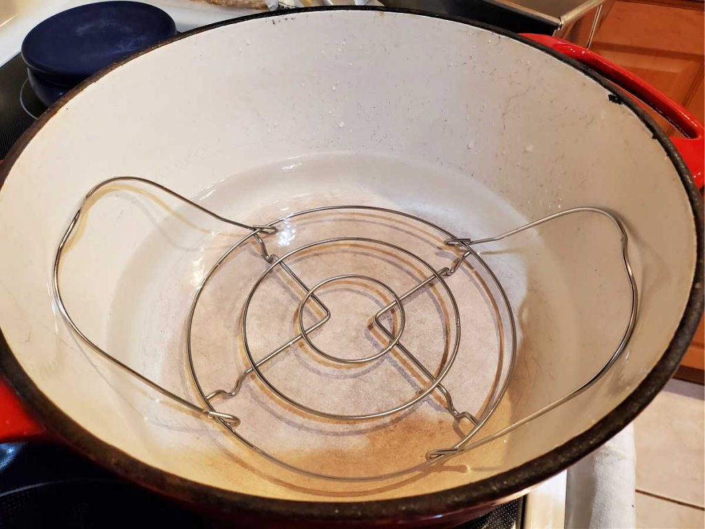 Dutch oven with steamer rack inside and about 2" of water.