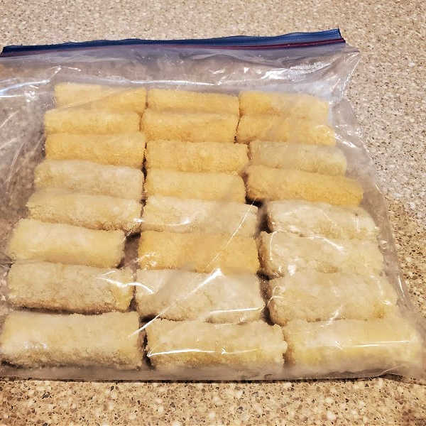 freezer bag of cheese sticks on counter