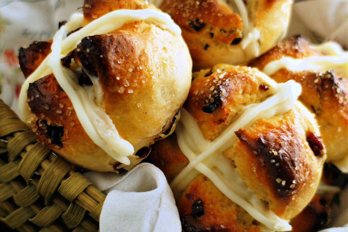 Close up of hot cross buns in a basket.
