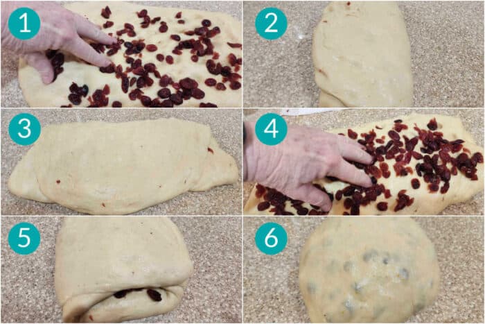 A collage of 6 images showing how to add dried cranberries to a bulk fermented cream cheese hot cross bun dough. The process is to press the dough out into a rectangle, spread out half of the cranberries over the surface, and fold up in thirds like a letter. Then press it out again in the other direction, and add the rest of the cranberries in a letter fold. Lastly, you'll make one more letter fold the opposite direction from the last inclusion, completely enclosing the fruit in the dough.