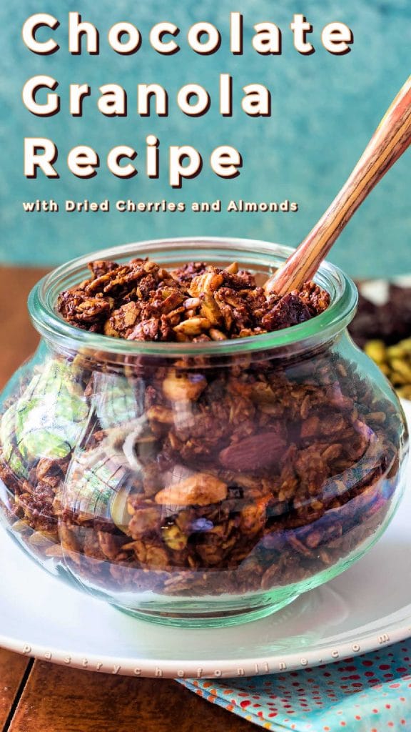 Jar of granola. Text reads "chocolate granola recipe with cherries and almonds."
