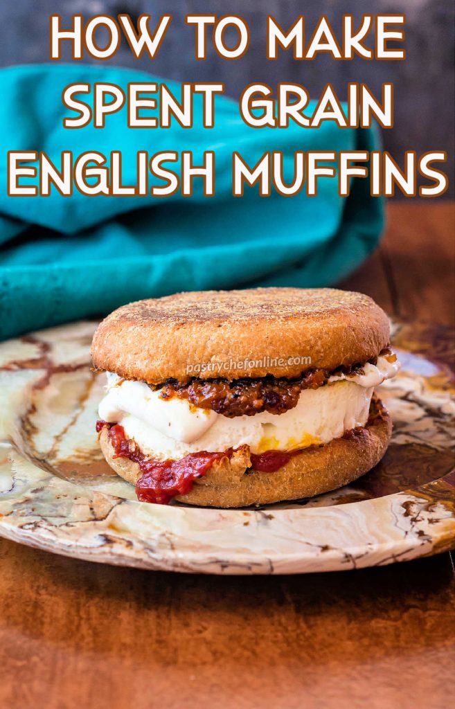 An English muffin breakfast sandwich on a neutral plate. Text reads, "How to make spent grain English muffins."