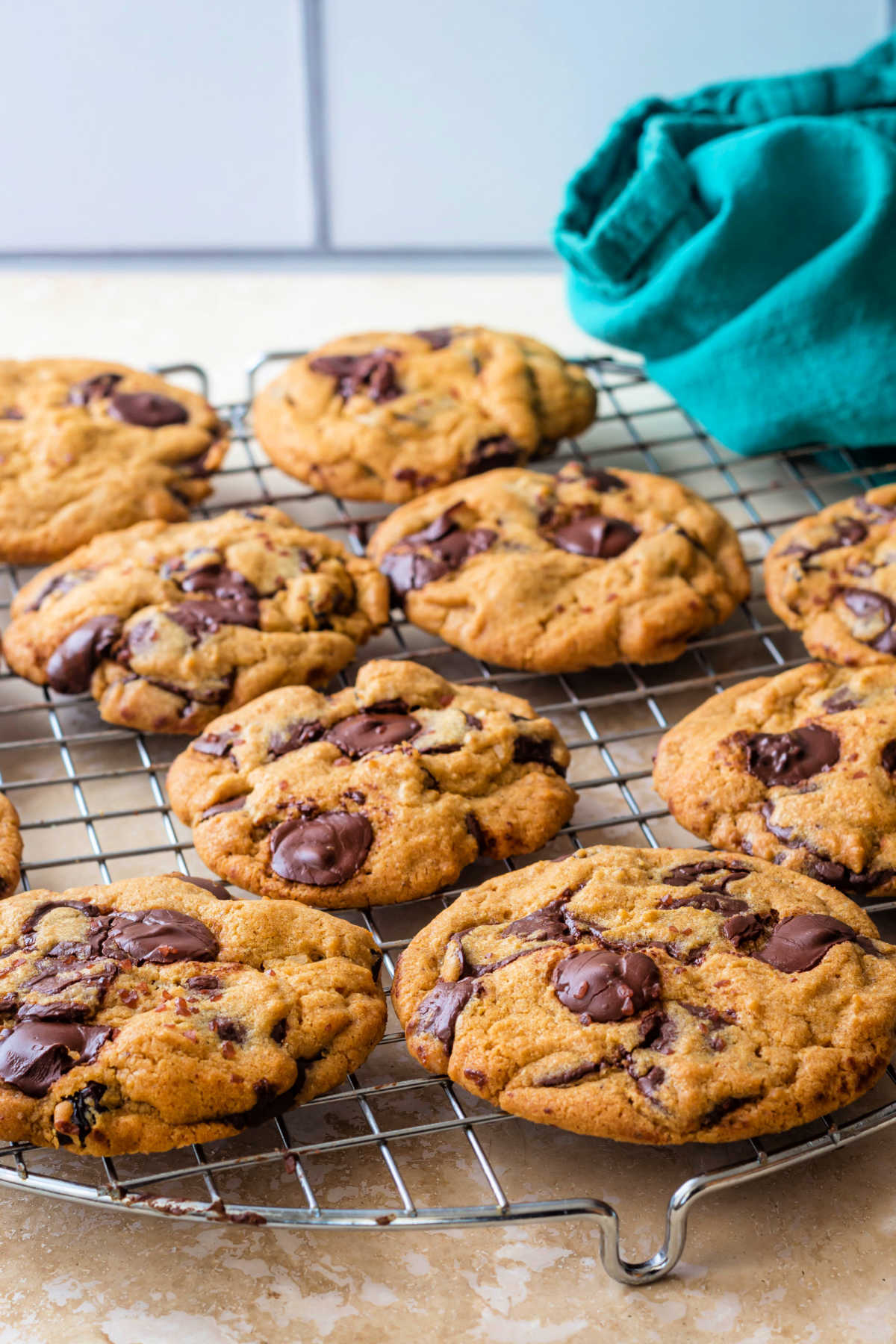 Brown butter toffee chocolate chip cookies on a cooling rack.