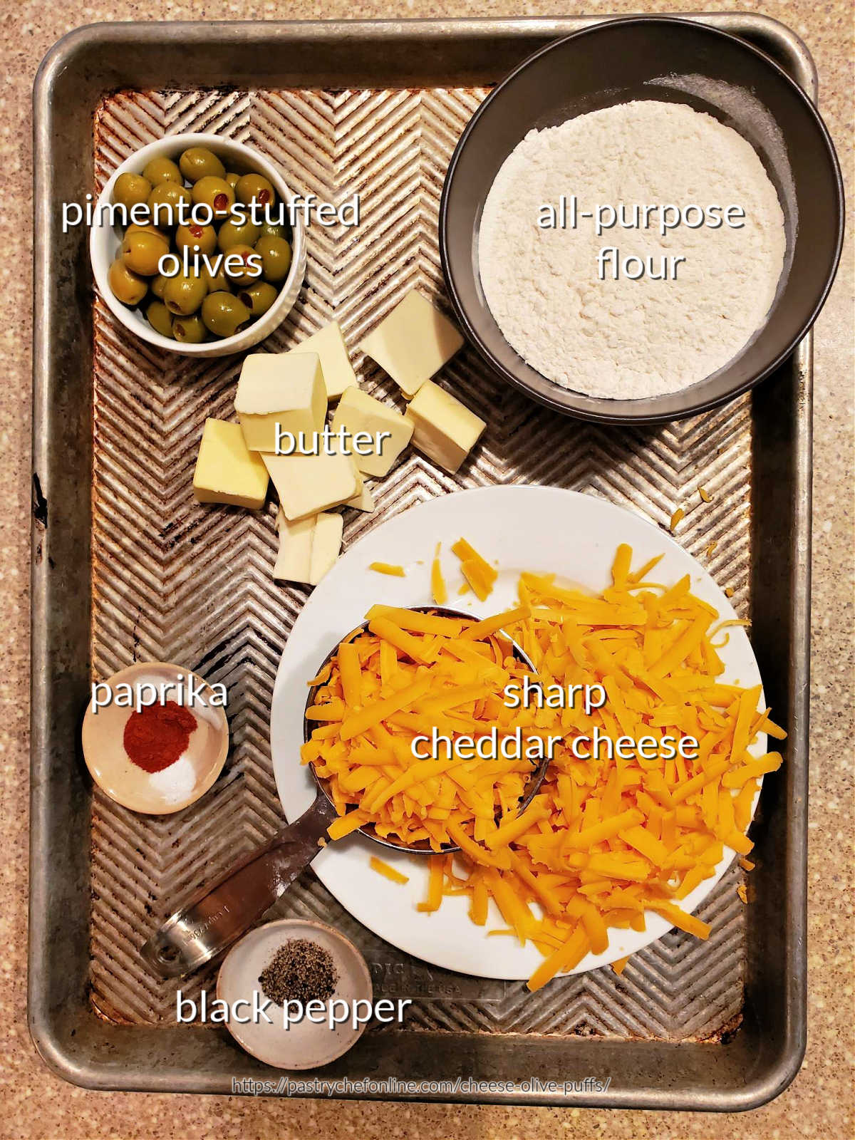 An overhead shot of all the ingredients needed for making olive cheese balls.