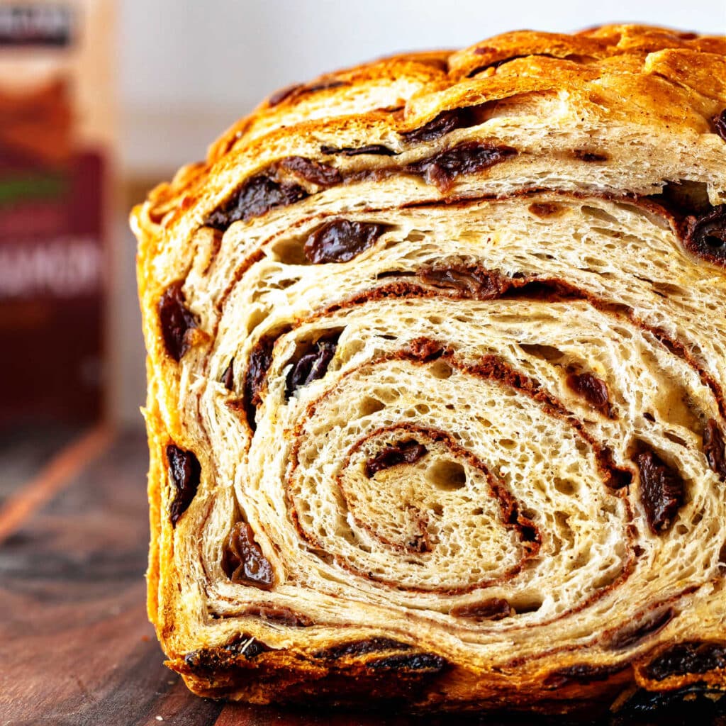 Soft cinnamon raisin bread with a tight cinnamon swirl and plump raisins throughout the loaf